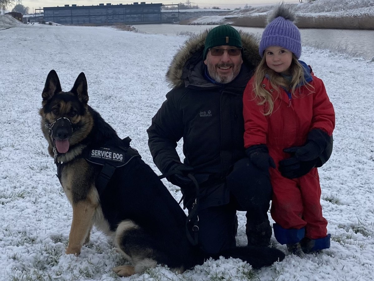 Saxon the German Shepherd out on a winter walk with his family